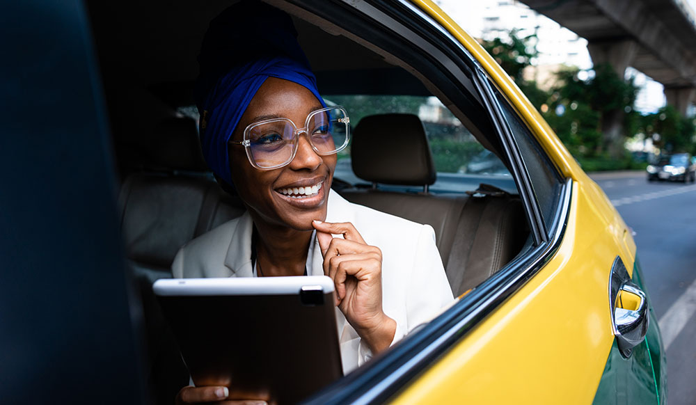 cheaptravel woman comuting in taxi