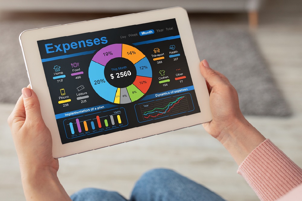 Lady with digital tablet, calculating her monthly spendings, copy space Use P-cards for better expense management