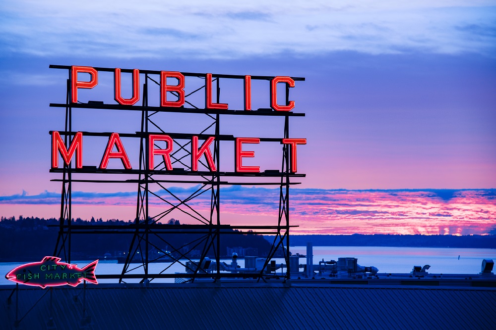 neon sign pike place seattle where to stay on a business trip Seattle