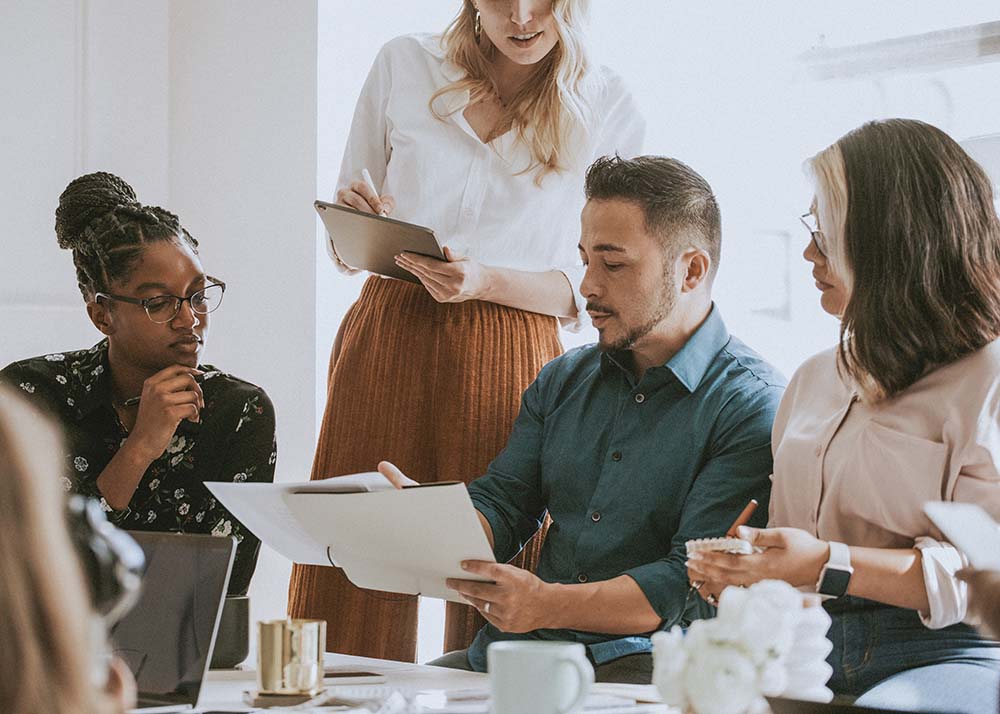 Businesspeople in a meeting using a digital tablet office managers on meeting
