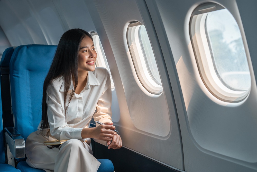 business class passenger in her seat on the airlines