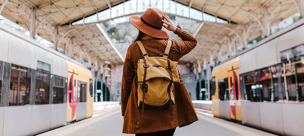 tourist-woman-at-train-station-waiting-to-take-a-t-2022-02-18-17-22-47-utc_1000x450