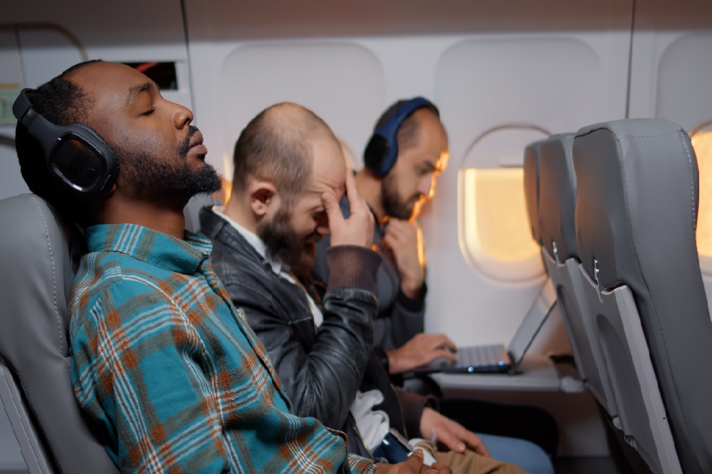 Diverse passengers flying in economy class with airplane