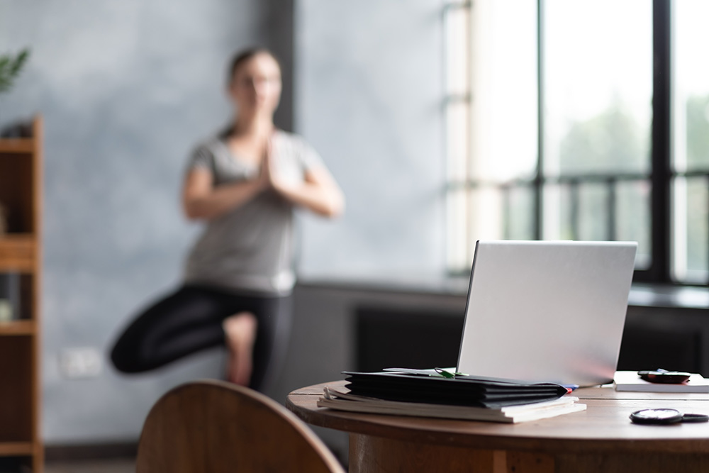 caucasian woman working yoga exercise doing balance exercise. work-life balance