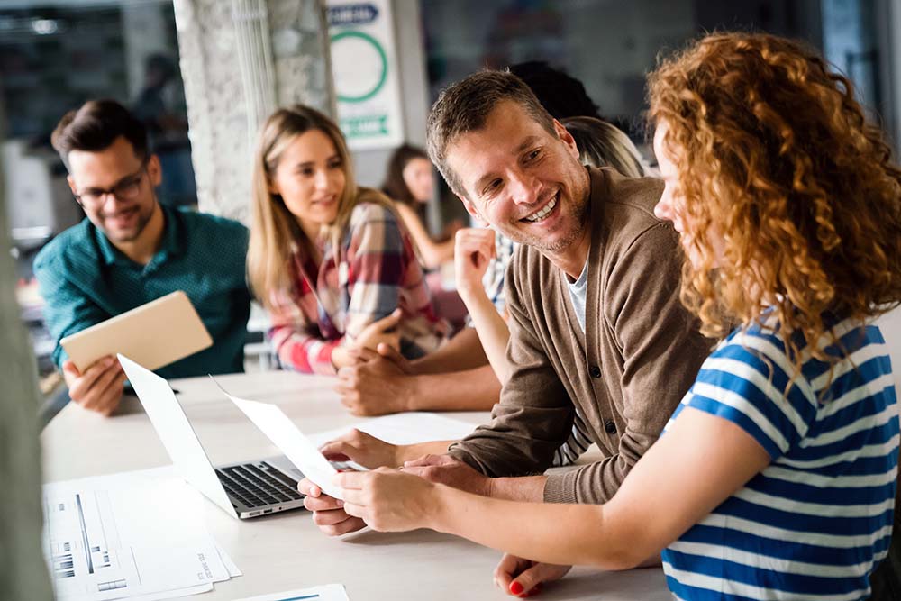 effective-processes How to improve office management. Two colleagues working together.